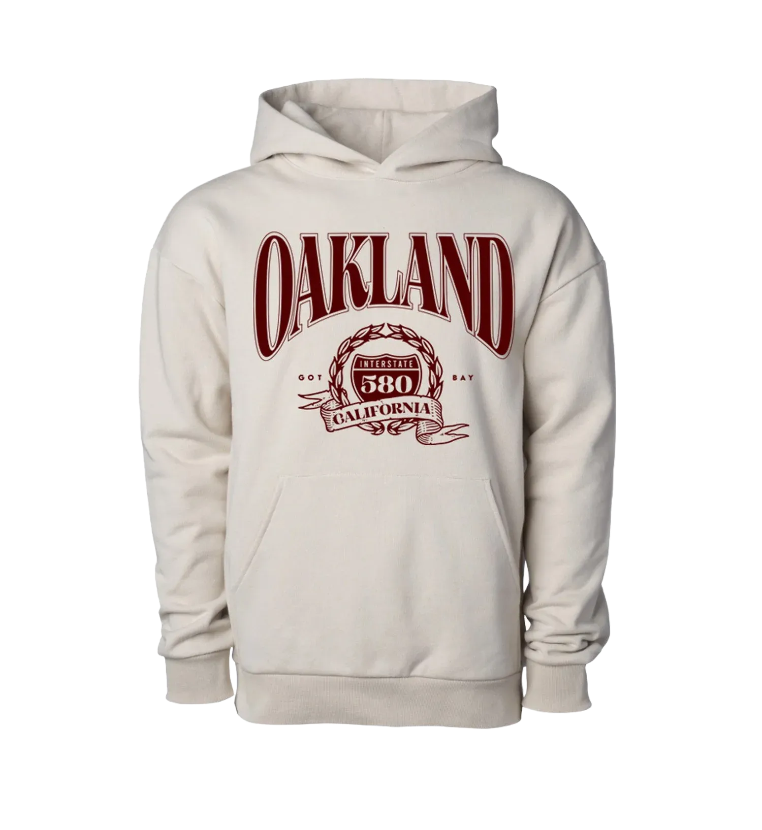 Cream hoodie with hood up, featuring maroon “OAKLAND” text and “580” graphic on the front