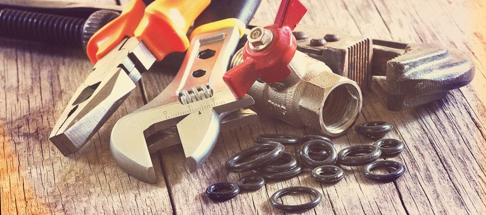 Plumbing Tools and Parts, Including Pliers, a Wrench, and a Valve — Mid Richmond Plumbers & Suppliers in Coraki, NSW