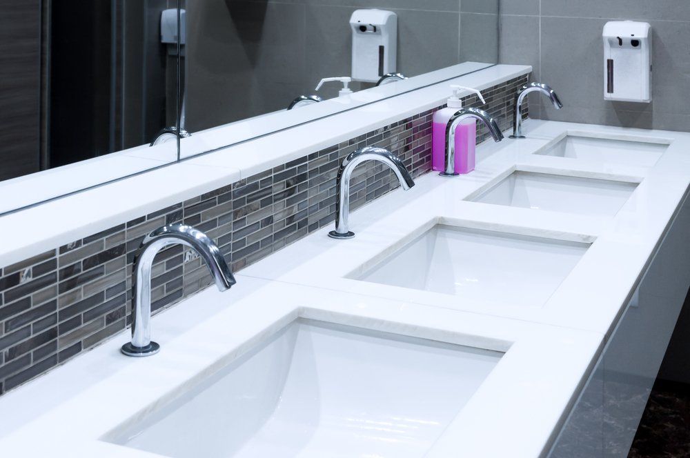 A Bathroom With Three Sinks and a Large Mirror — Mid Richmond Plumbers & Suppliers in Grafton, NSW
