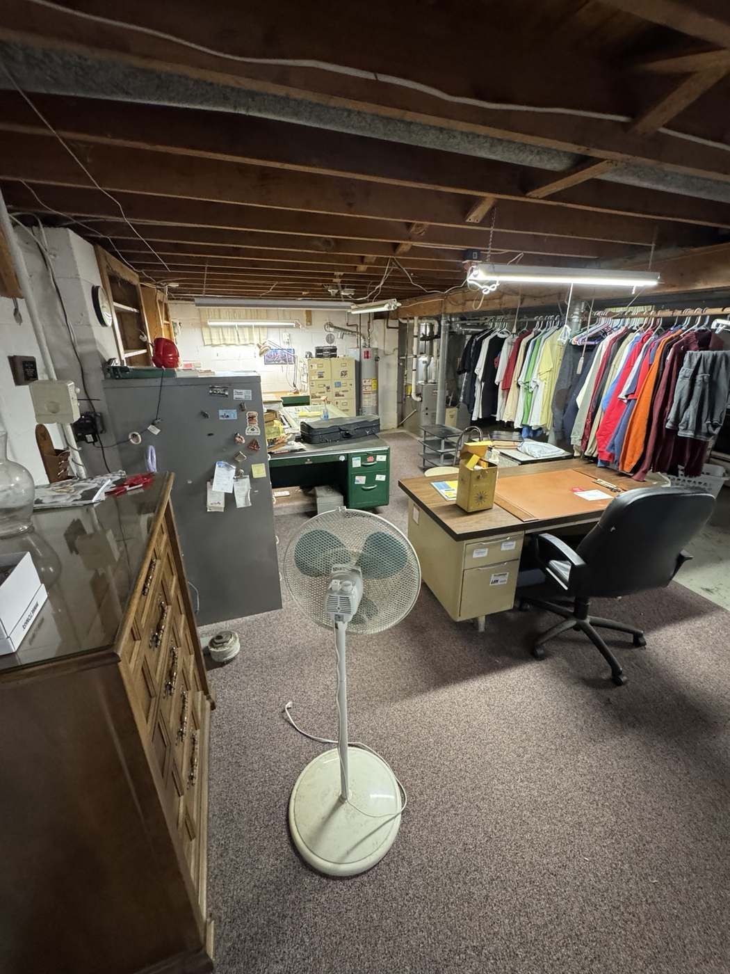 Cluttered basement before cleanout