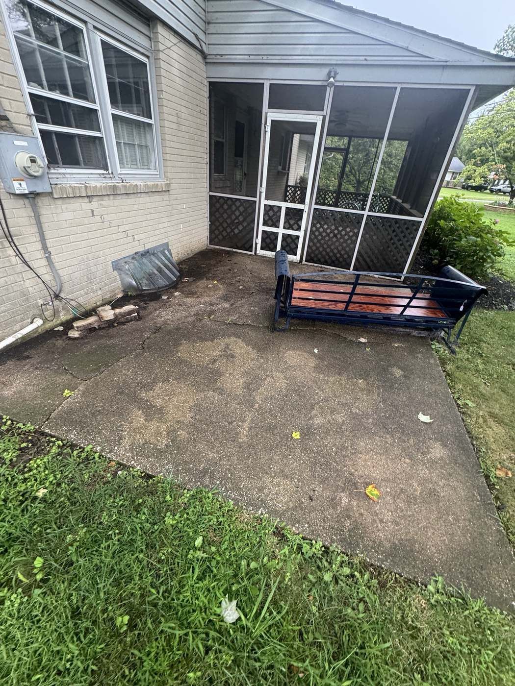 Dirty concrete patio before cleaning