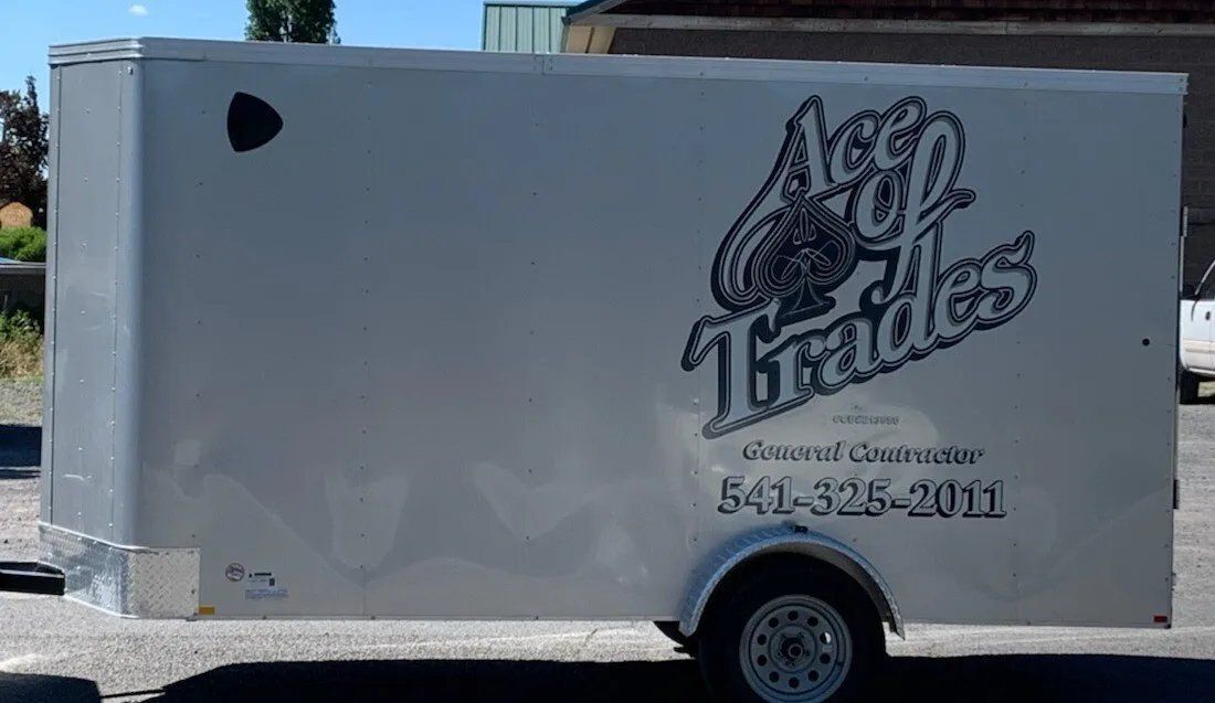A white trailer with the word trades on it