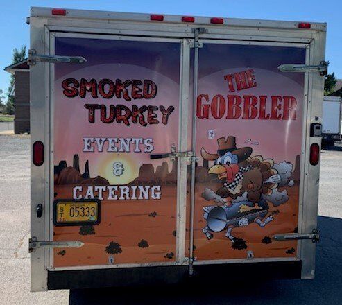 A trailer that says smoked turkey events & catering