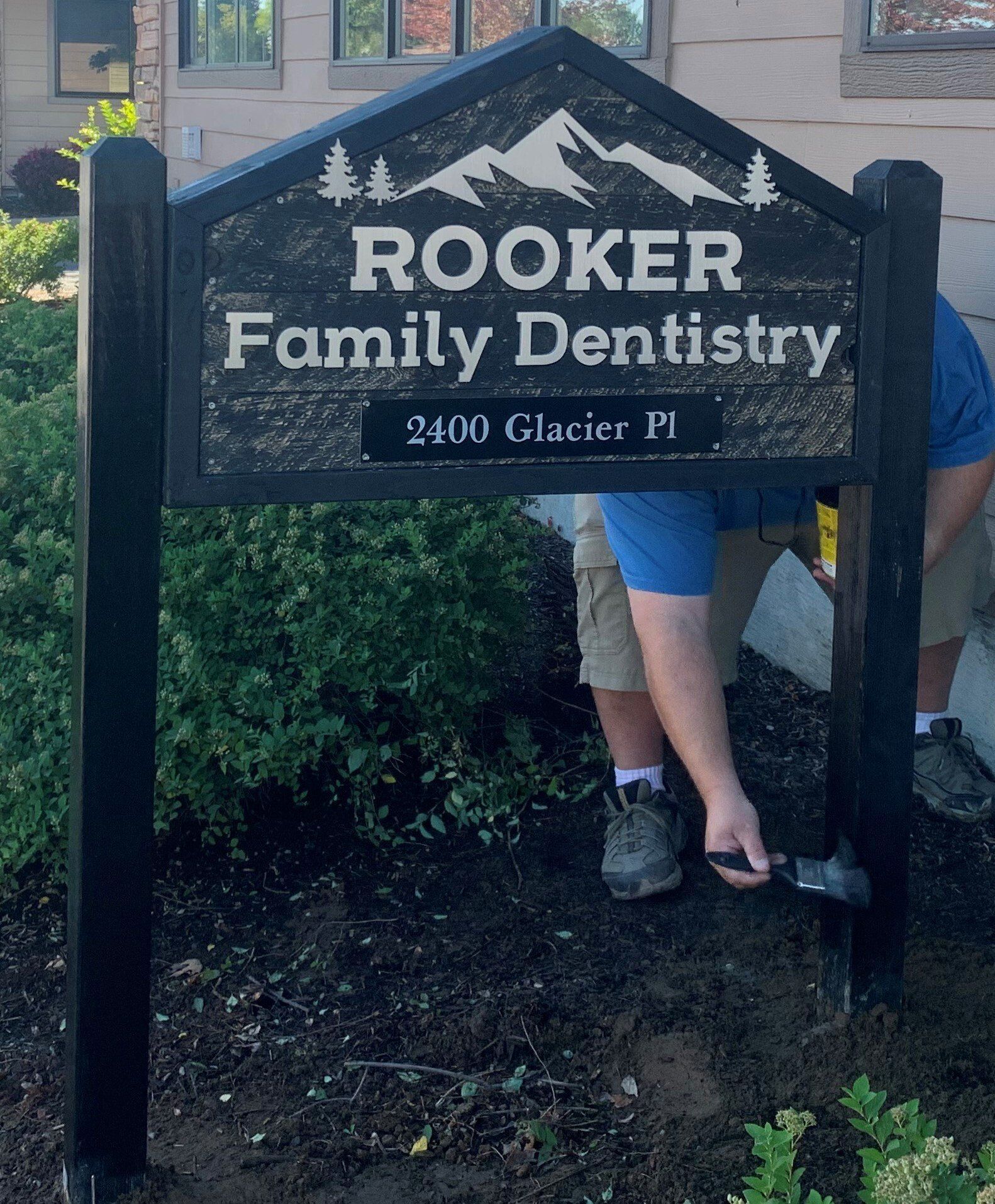 A sign for rooker family dentistry is being installed