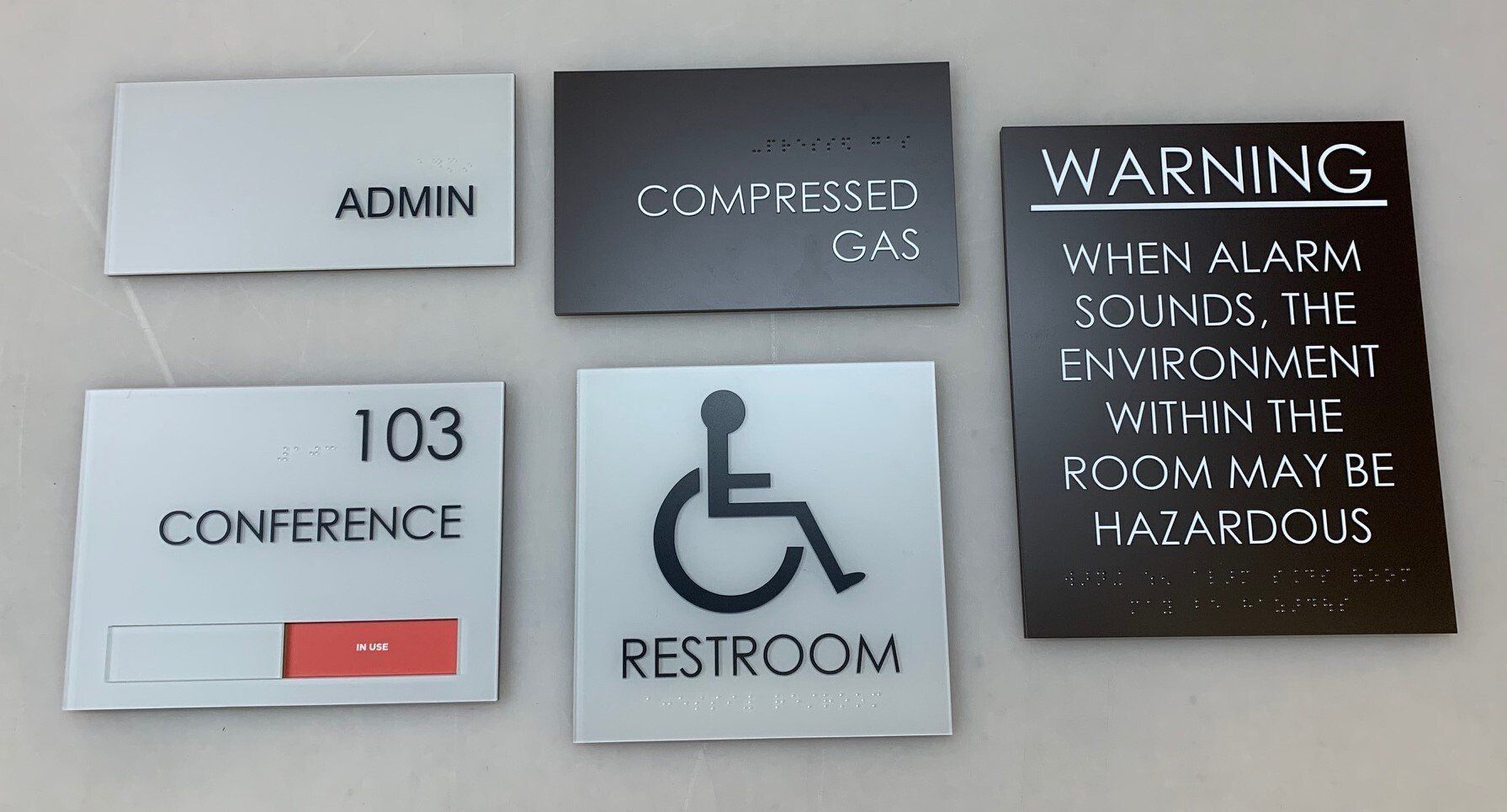 A collection of signs including one for a conference room