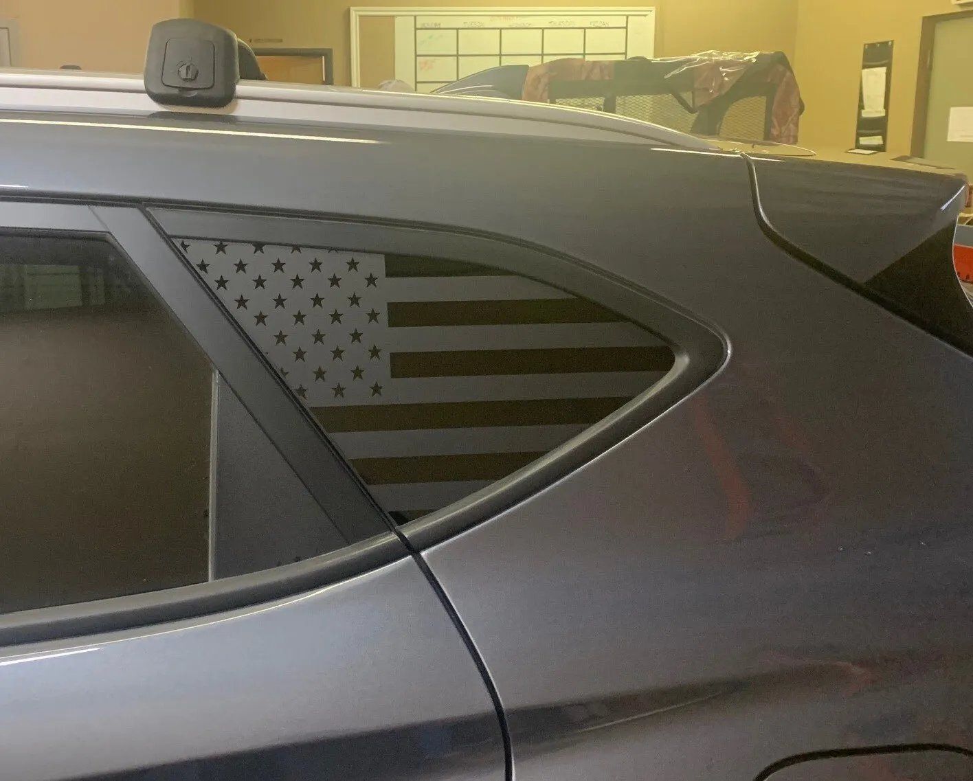 A car with an american flag on the side of it