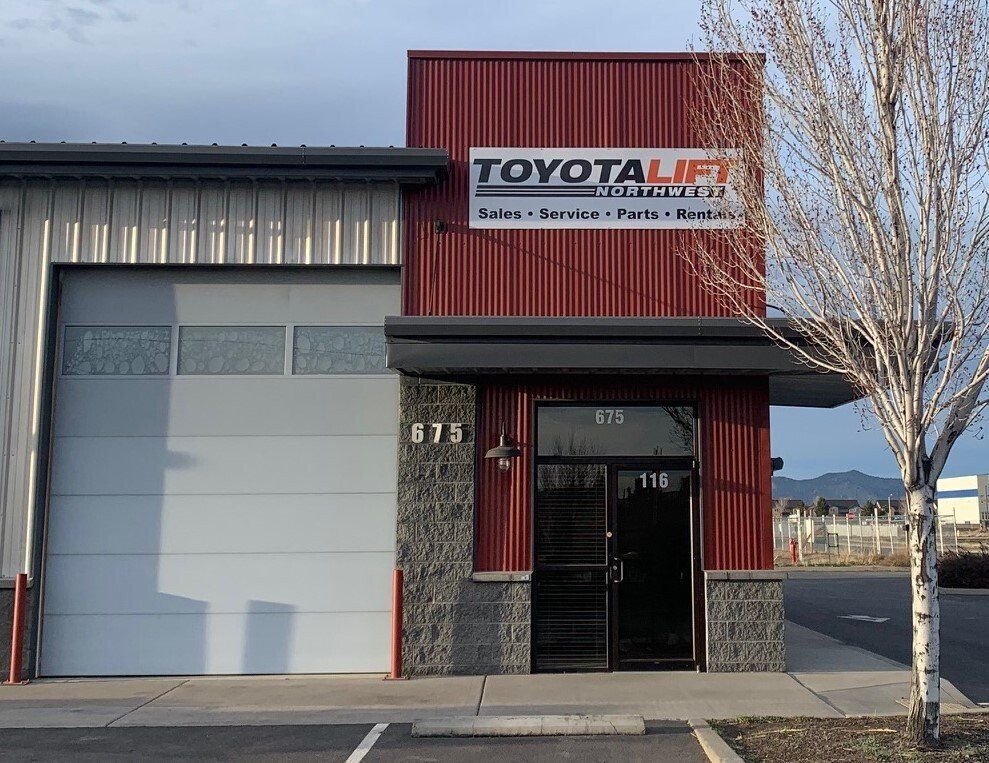 A red building with a sign that says toyota lift