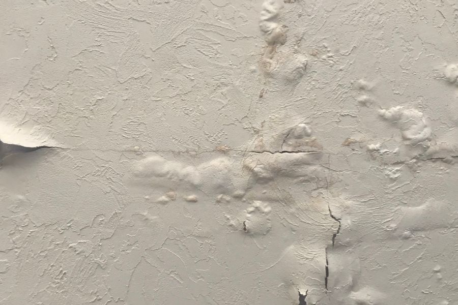 Mold growth behind a baseboard, the result of hidden moisture that was left untreated after a water damage event
