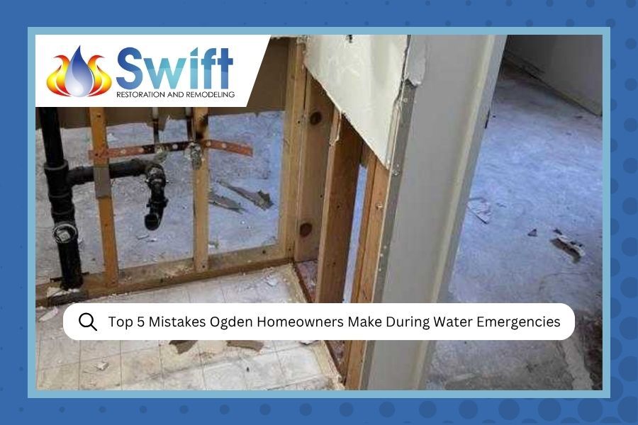 A man struggles to fix a spraying kitchen faucet while a person behind him calls for help on a phone; 