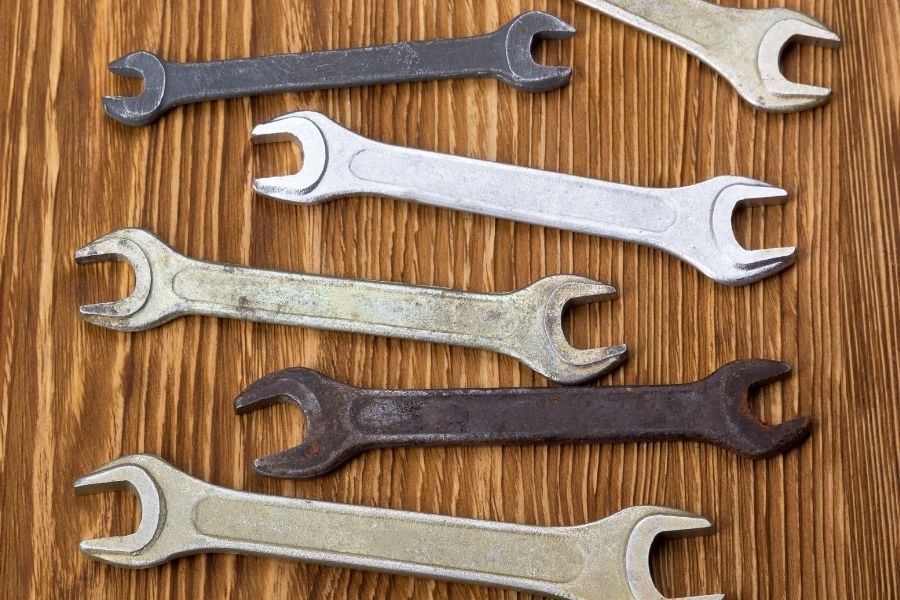 Adjustable wrenches for emergency water shutoff