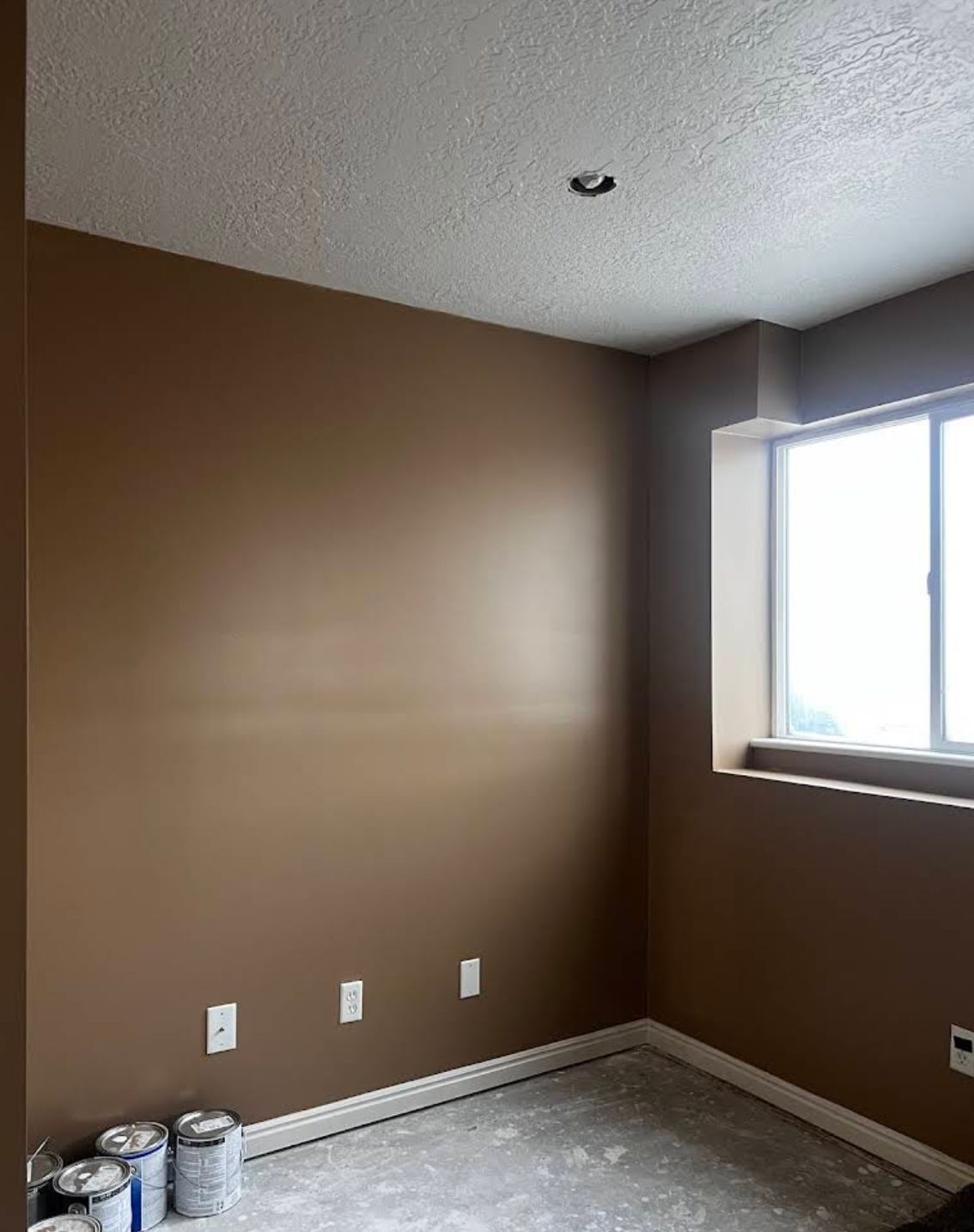 Completed wall and ceiling restoration with fresh drywall and smooth finish after water damage repair in Layton UT