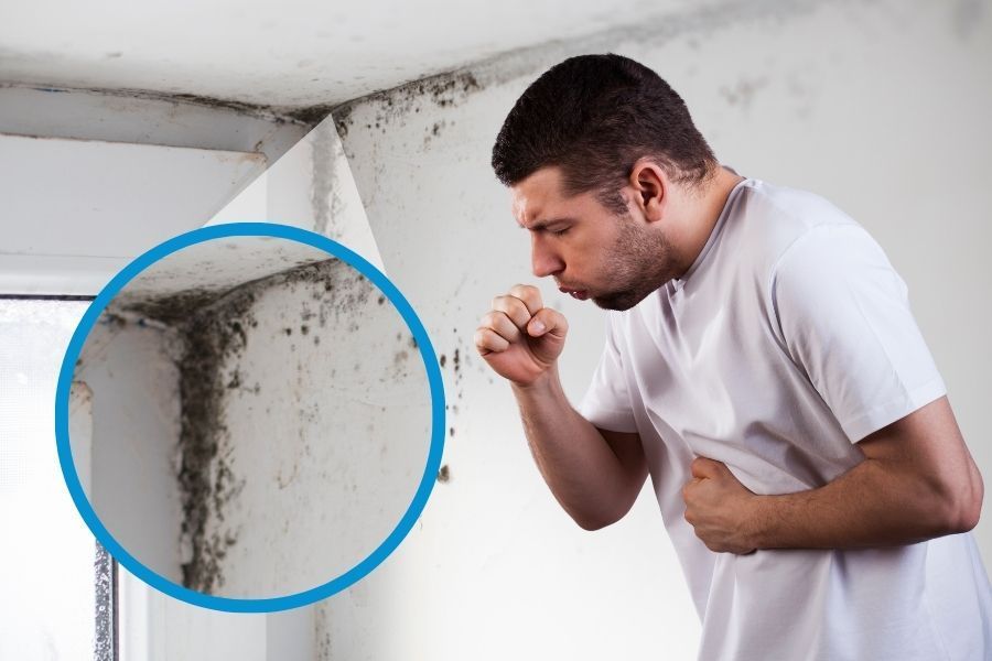Person experiencing allergy symptoms including sneezing and congestion that can result from mold exposure in a home