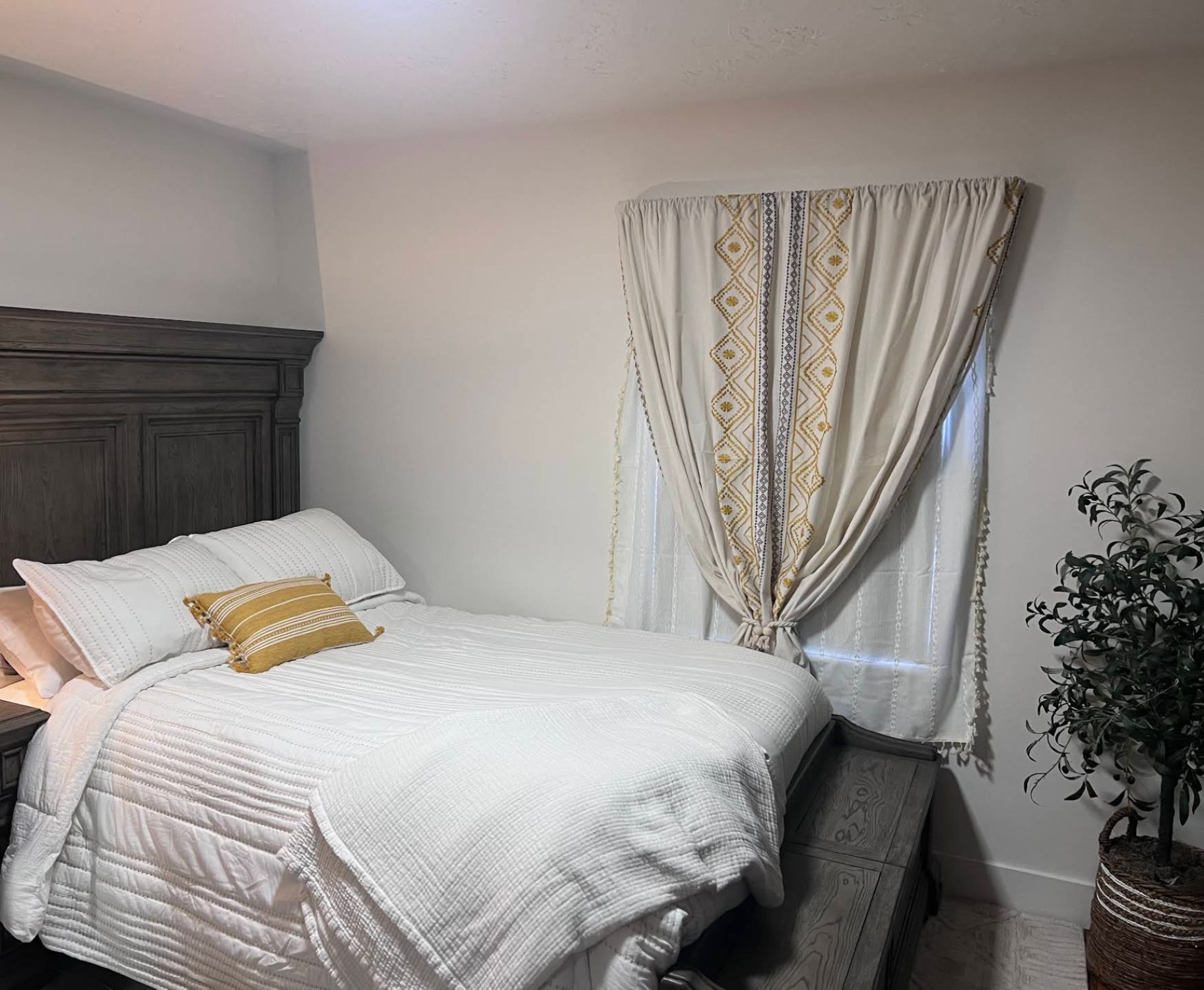 Remodeled bedroom with neutral walls and new furniture in Kaysville UT whole-home renovation
