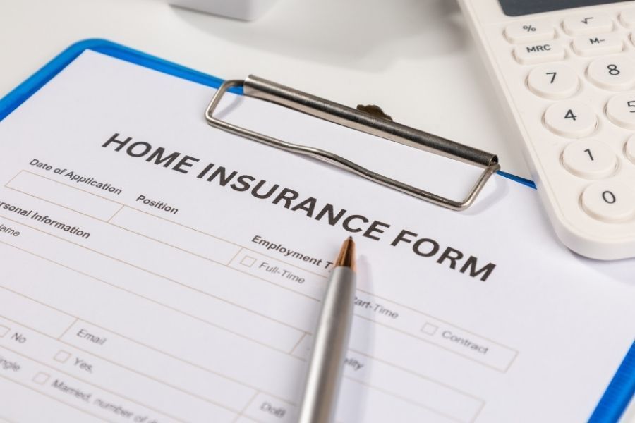 Homeowners insurance policy documents on a desk