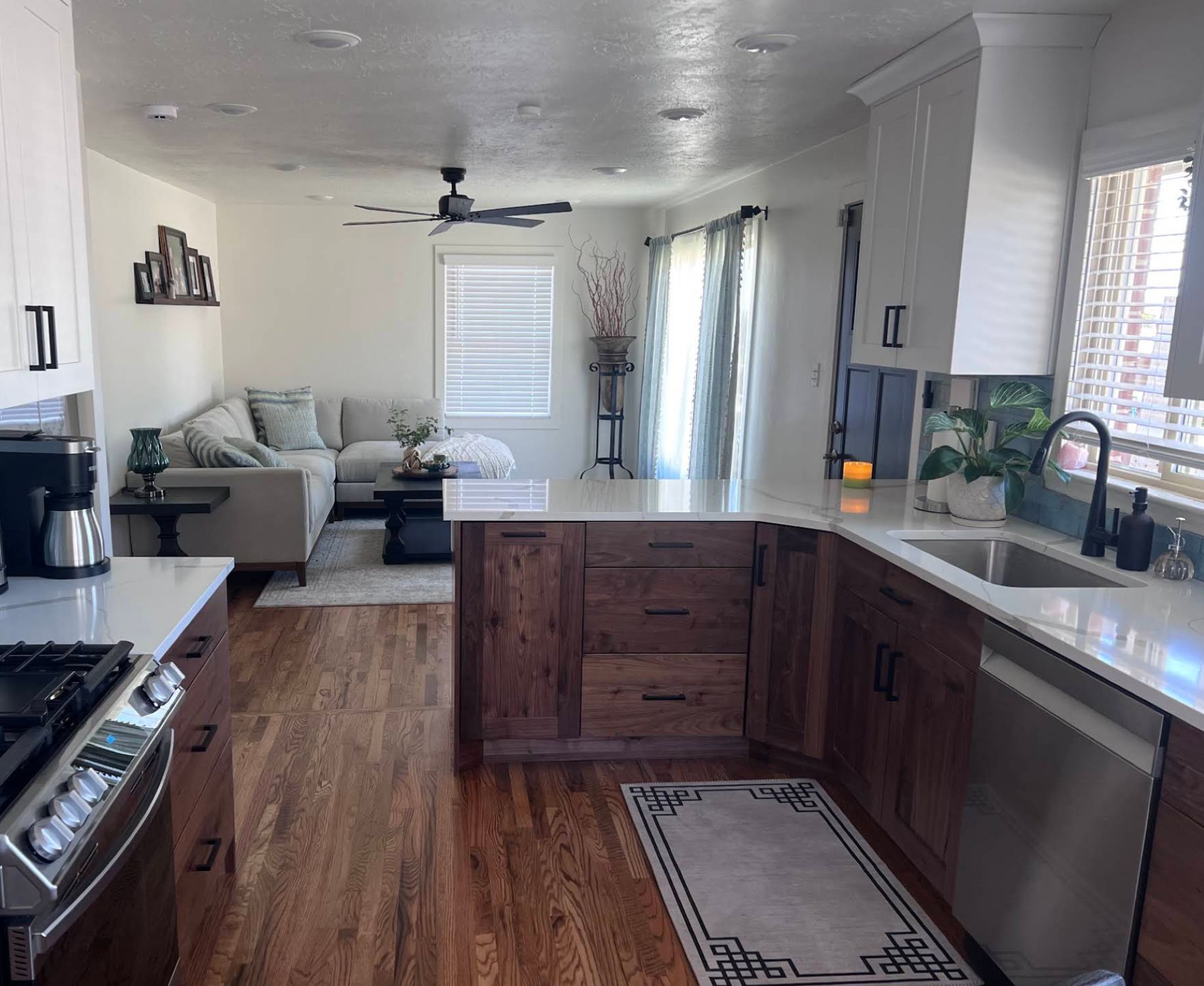 Remodeled kitchen with quartz countertops and blue tile backsplash in Kaysville UT