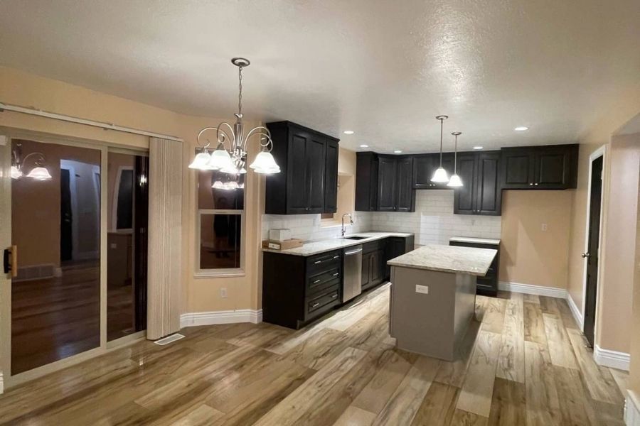 Modern kitchen remodel with new cabinets and countertops after fire damage reconstruction