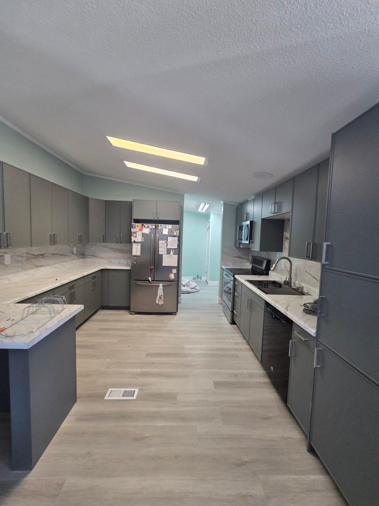 New kitchen backsplash and updated flooring after water damage restoration