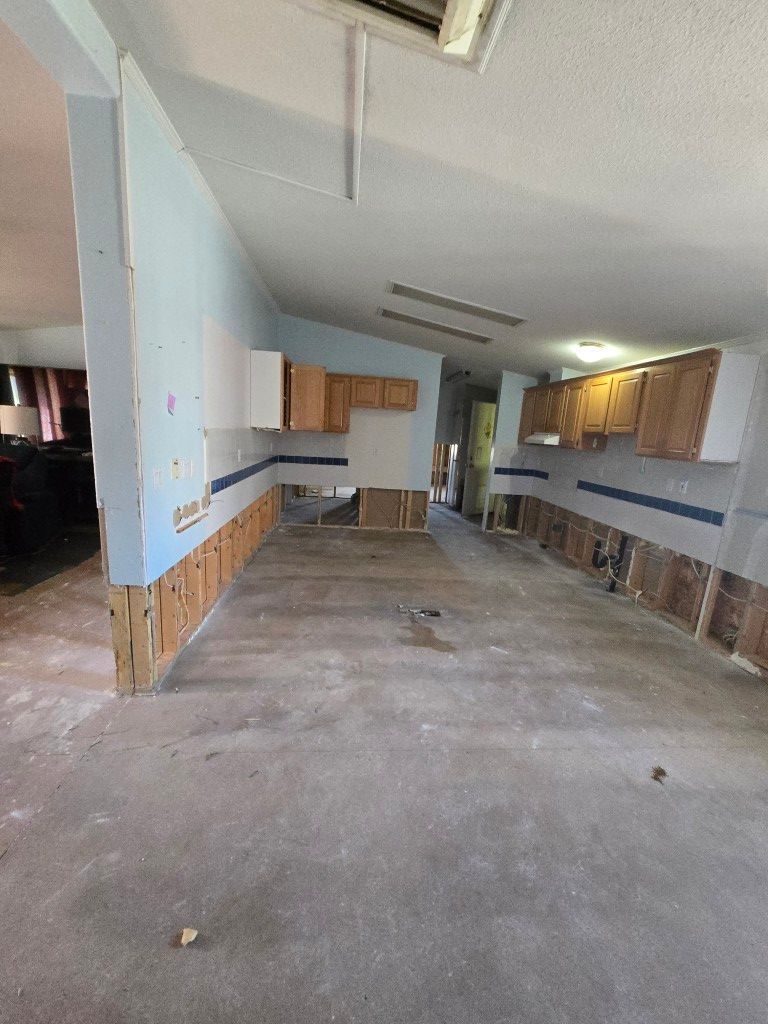Bottom kitchen cabinets removed during water damage demolition phase