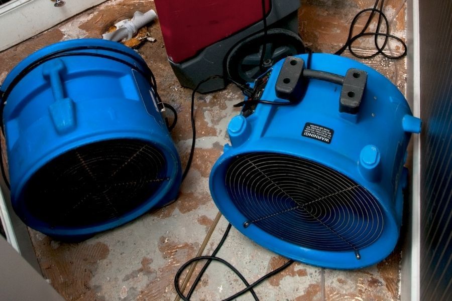 Professional water damage restoration equipment in action