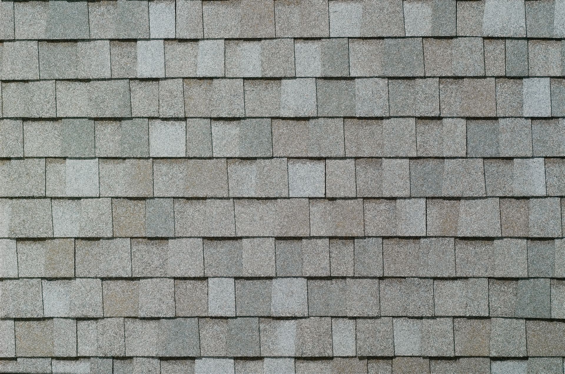 Gray shingle roof texture with layered rectangular tiles