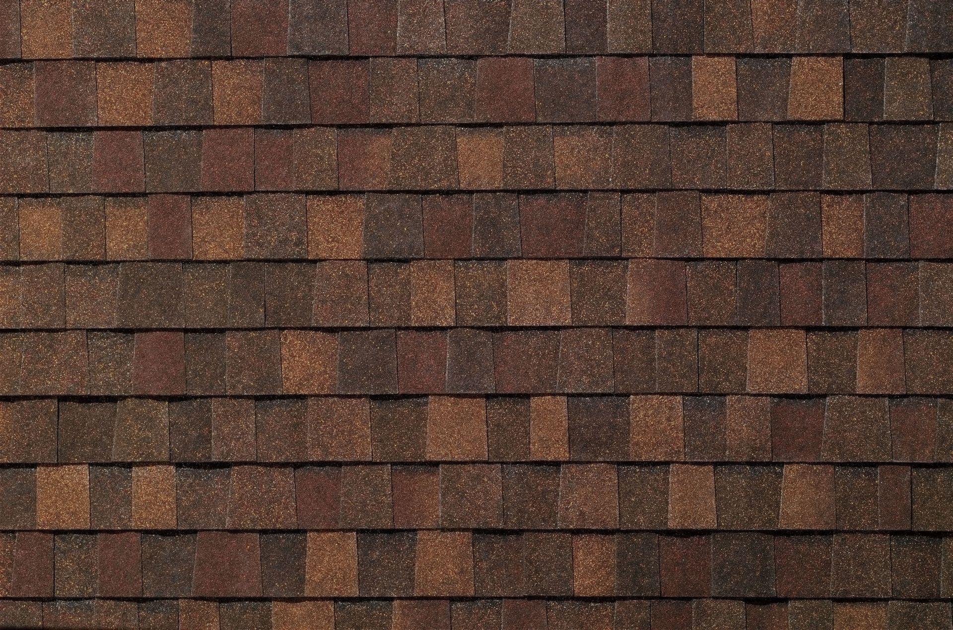 Brown roof shingles in a repeating horizontal pattern