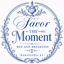 Blue circular logo reading “Savor the Moment Bed and Breakfast,” Bardstown, KY, with decorative flourishes.