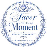 Blue circular logo reading “Savor the Moment” for a bed and breakfast in Bardstown, KY