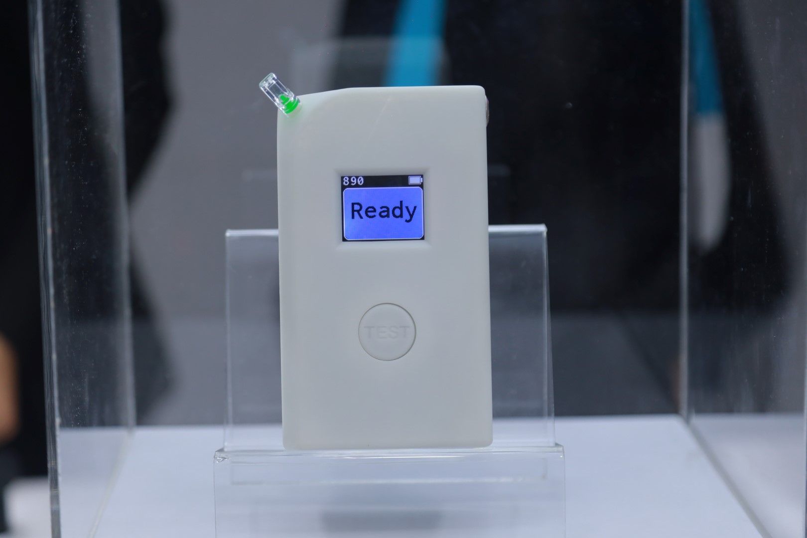A white device with a screen that says ready on it