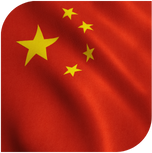 A red flag with yellow stars on it is waving in the wind.