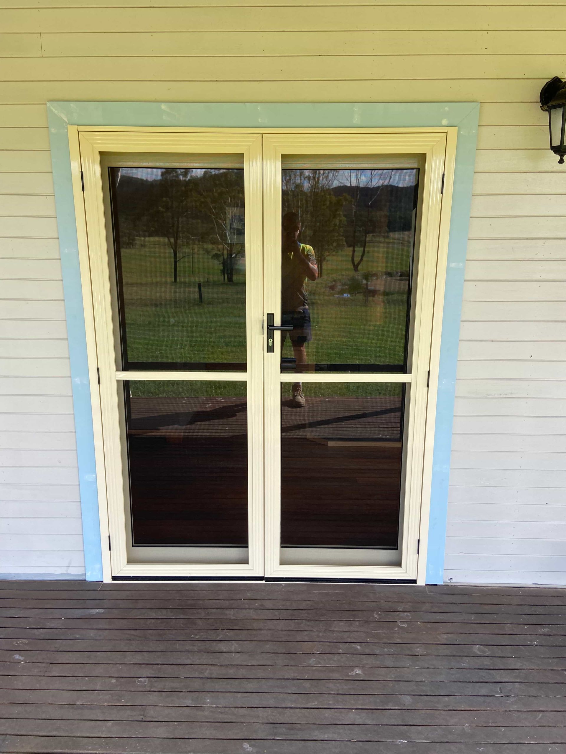 A white house with a sliding glass door — Browny's Glass & Aluminium in Wingham, NSW
