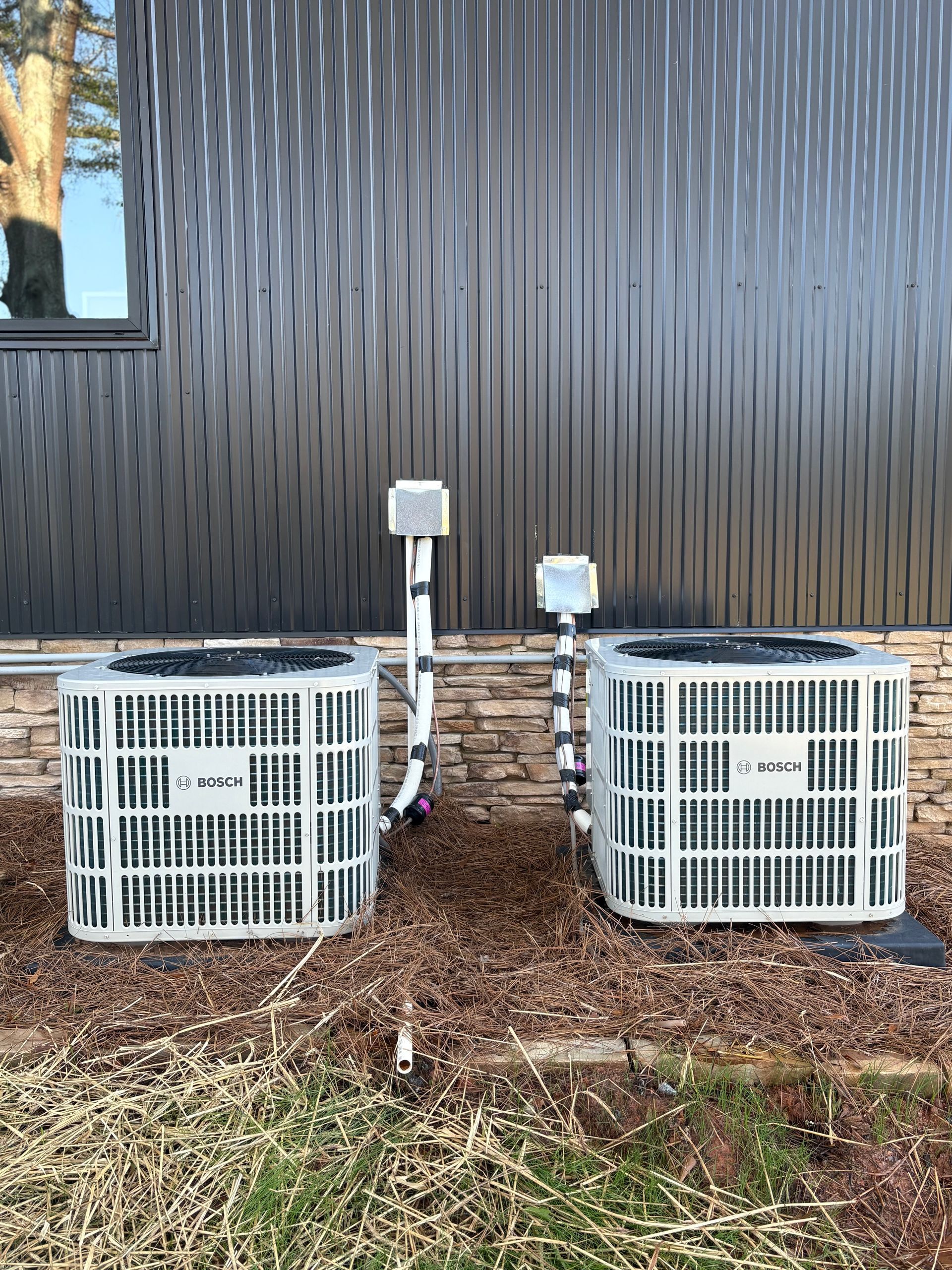 A basement with a water heater and a furnace.