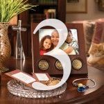 A table with a picture frame and a number three on it.