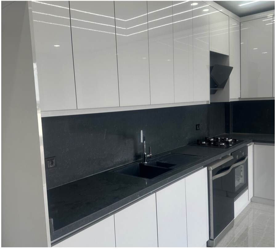 Stylish new shiny white kitchen cabinets