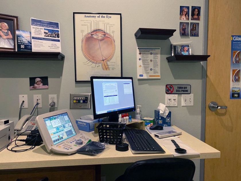 A view of the primary optometrist's office, including computer and eye charts