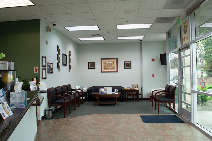 patient waiting room with a couch chairs