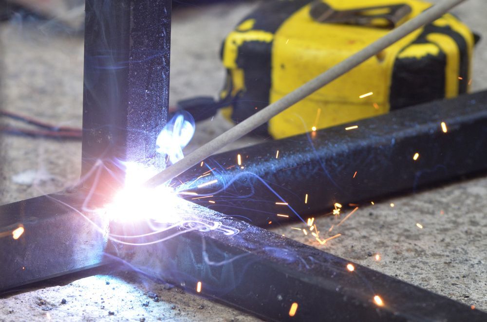 A Close Up Of A Person Welding A Piece Of Metal — Tinman's Welding Worx In Mackay, QLD