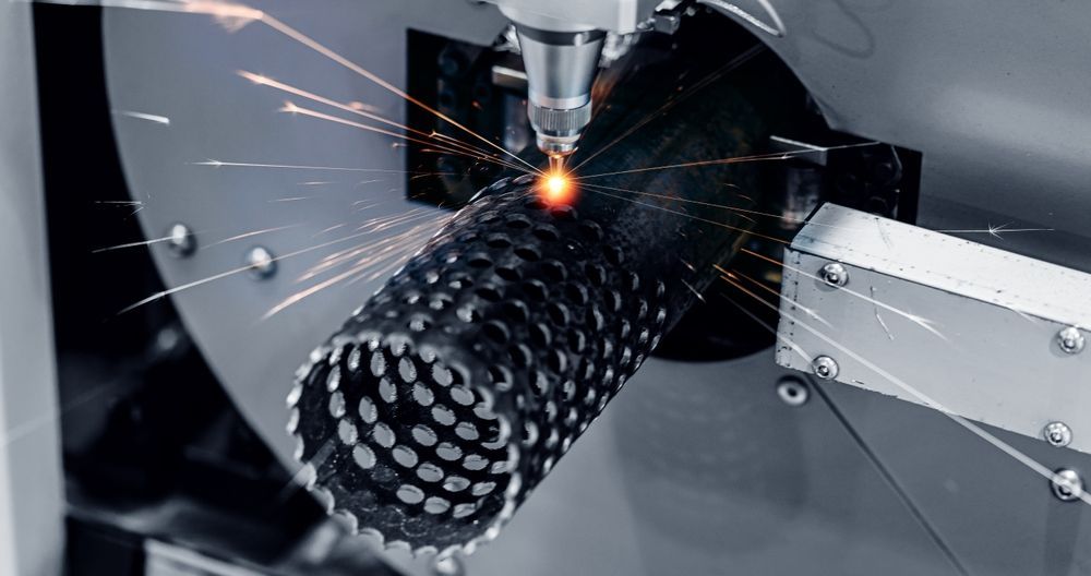 A Machine Is Cutting A Metal Pipe With Sparks Coming Out Of It — Tinman's Welding Worx In Mackay, QLD