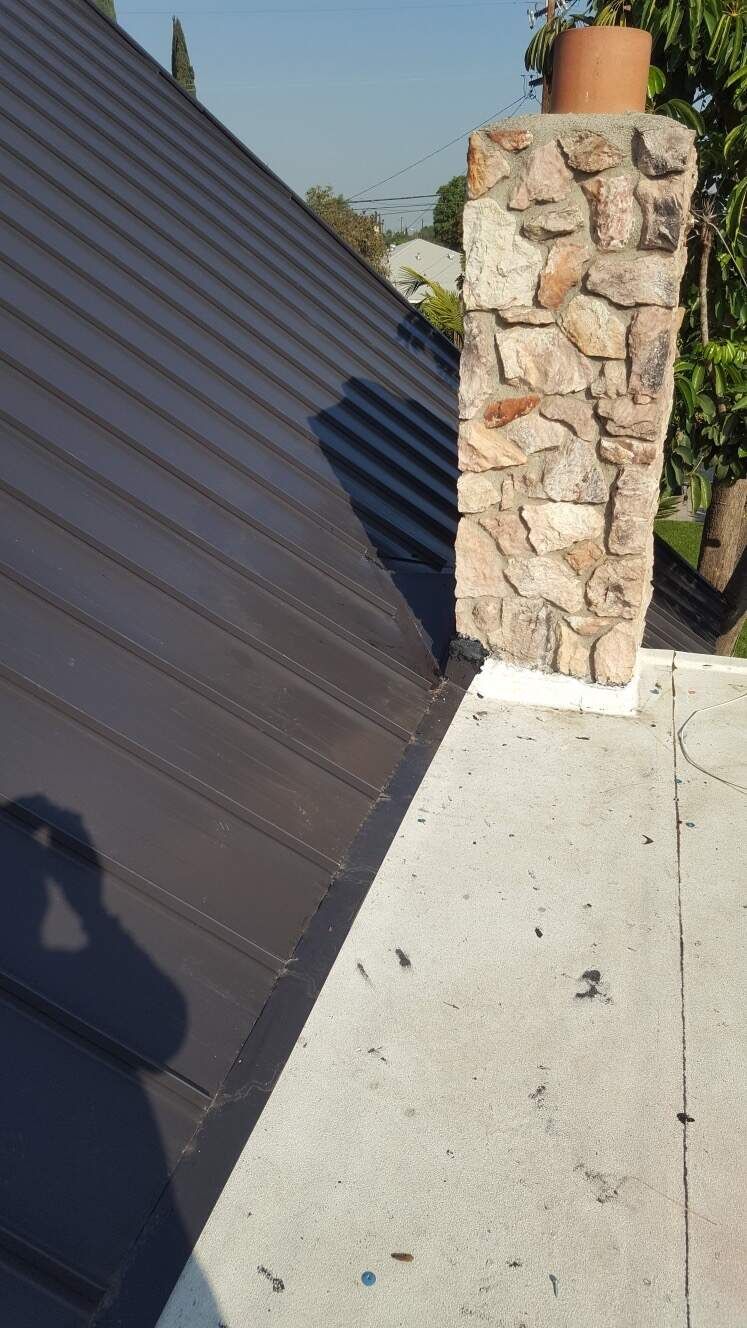 metal roofing project with custom chimney