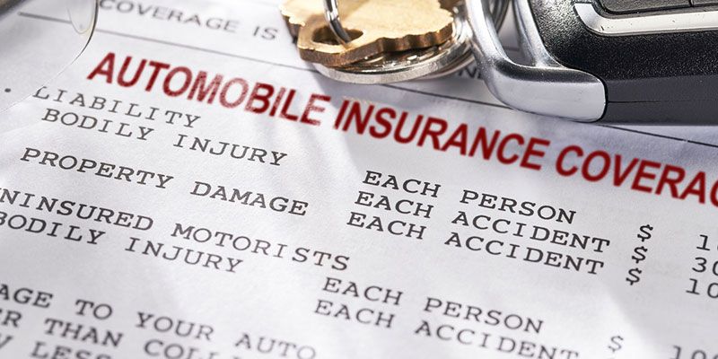 A close up of an automobile insurance coverage form
