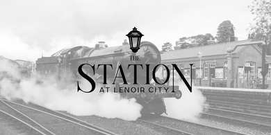 Steam train at a historic station platform with the word “STATION” overlaid