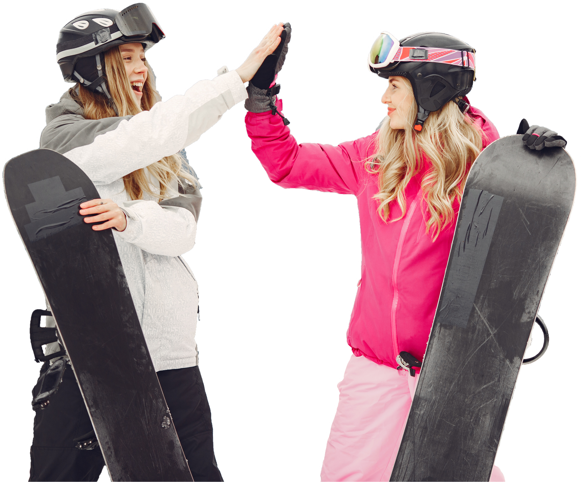 Two snowboarders in helmets high-five, each holding a snowboard, on a white background