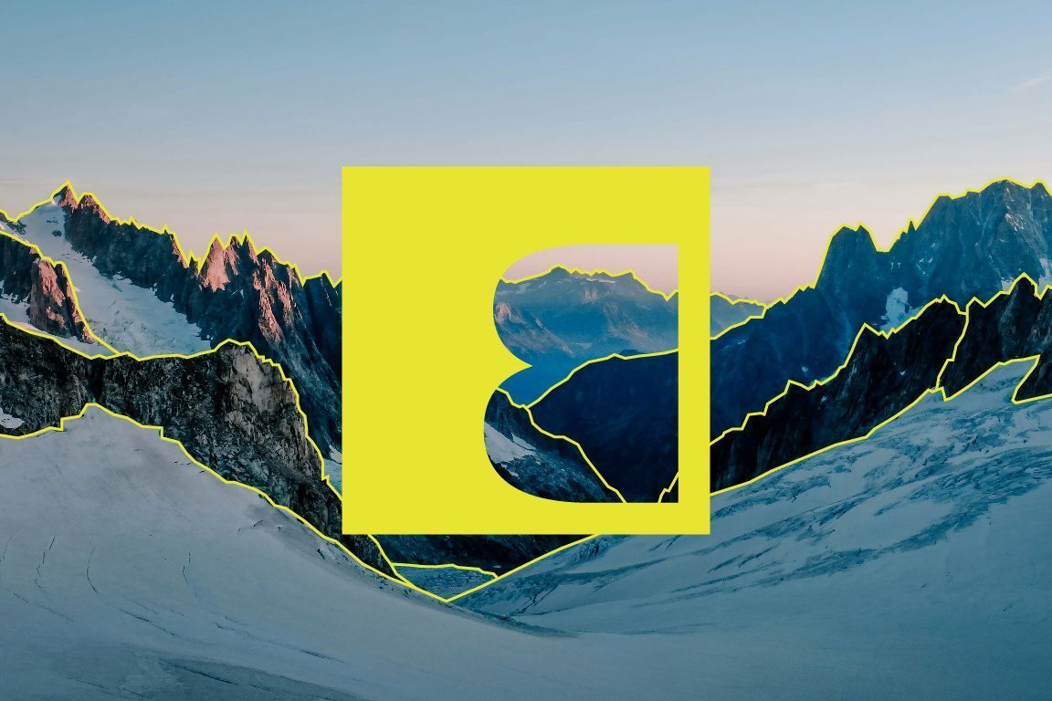 Snowy mountain valley with a yellow National Geographic-style frame over the center