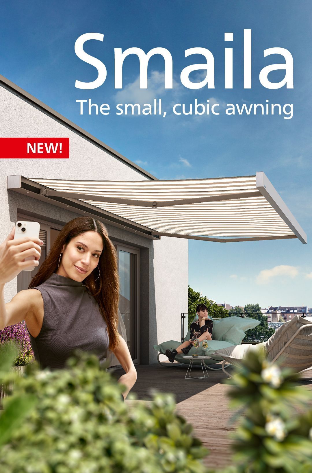 Woman taking selfie under awning, another person seated outside. The awning is white and labeled