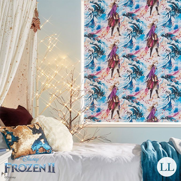 A bedroom scene with a bed, Frozen 2 patterned window blind, and decorative pillows.