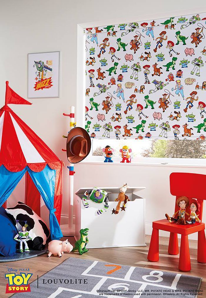 Toy Story-themed kids' room with tent, toys, window blind, and red chair.