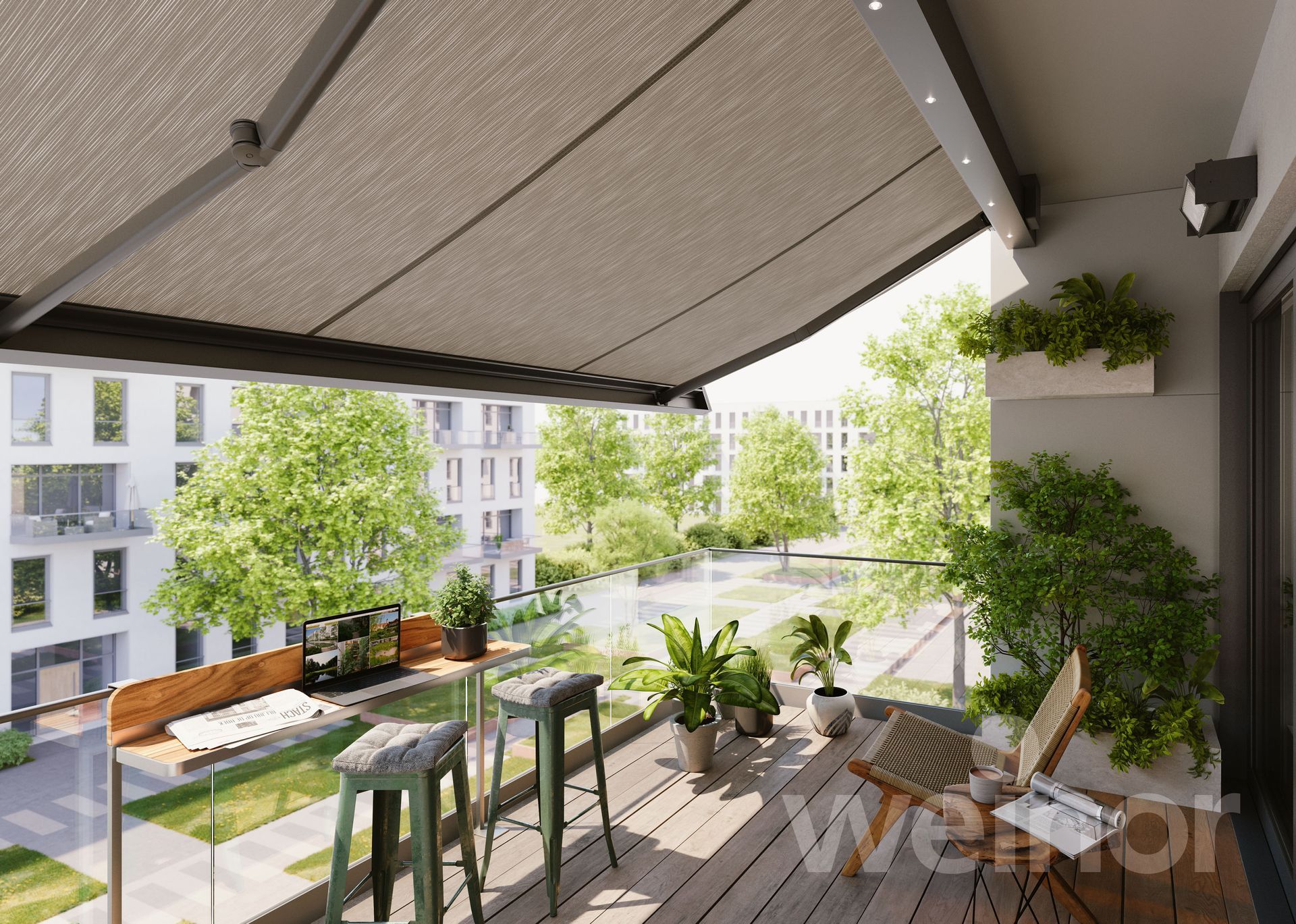 Balcony with awning, plants, and seating overlooking a courtyard with trees and a building.