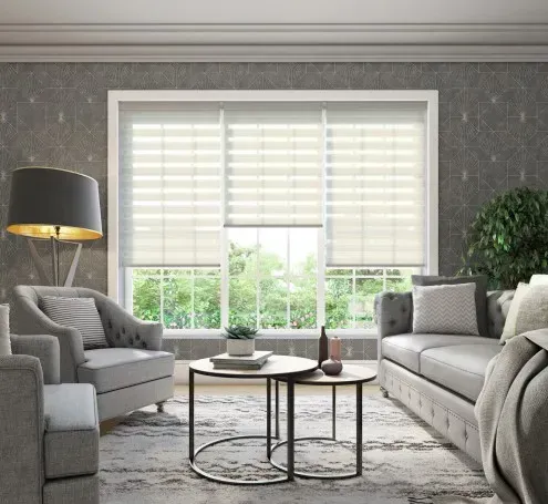 Living room with light-colored blinds over three windows, gray couch, chairs, and coffee tables.