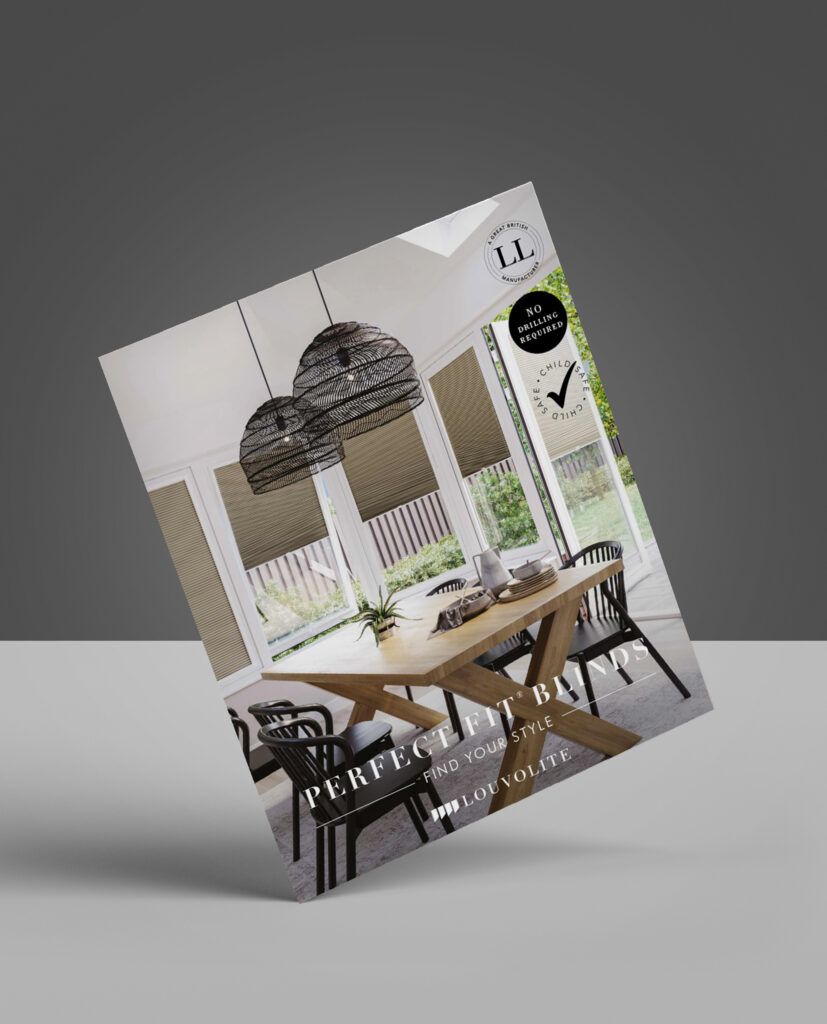 Catalog cover showing a dining room with blinds, table, chairs, and hanging lights.