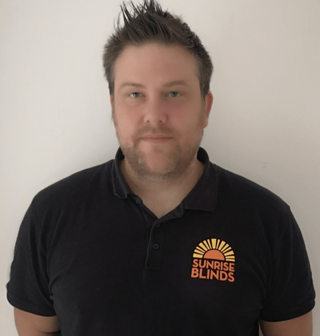 Man wearing a black polo shirt with