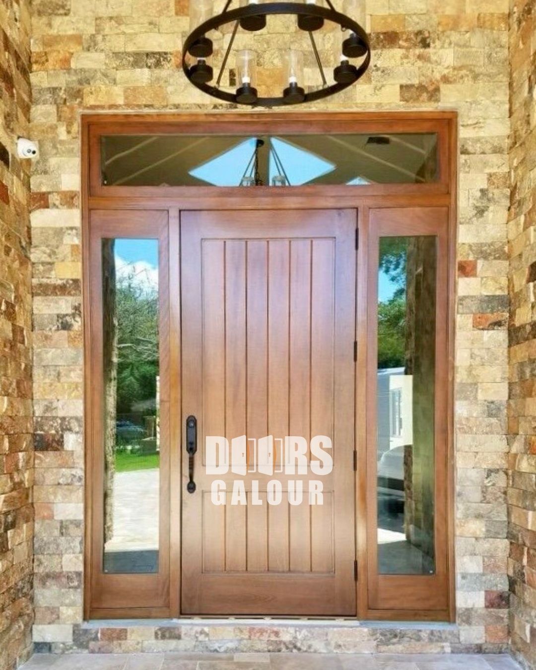 Wooden front door with sidelights and brick surround reading “DEETS SALOON”